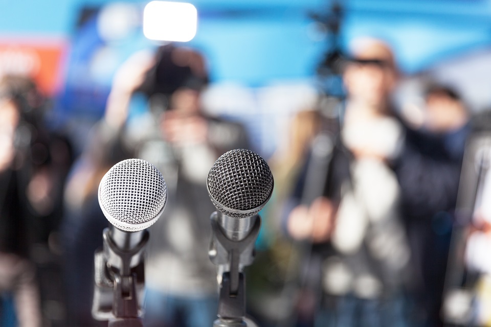 Microphones for a speaking event